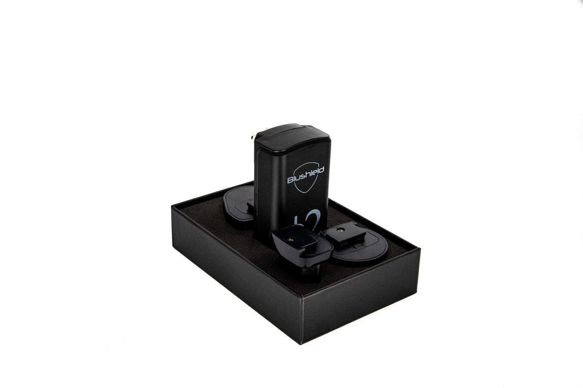 Phi Φ 2 Plugin device for EMF Protection for Small Homes, resting in a sleek black packaging.