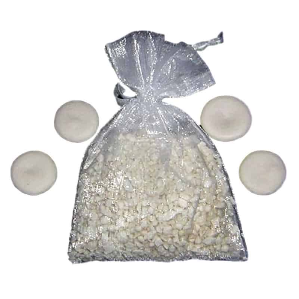 Clear plastic bag filled with white pebbles or stones, with four additional white spherical objects on a white background.
