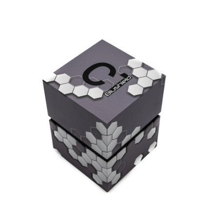 A dark gray cube-shaped product box with a black 'C' logo and the word 'Brushless' printed on the top, decorated with white hexagonal patterns, shown on a plain white background.