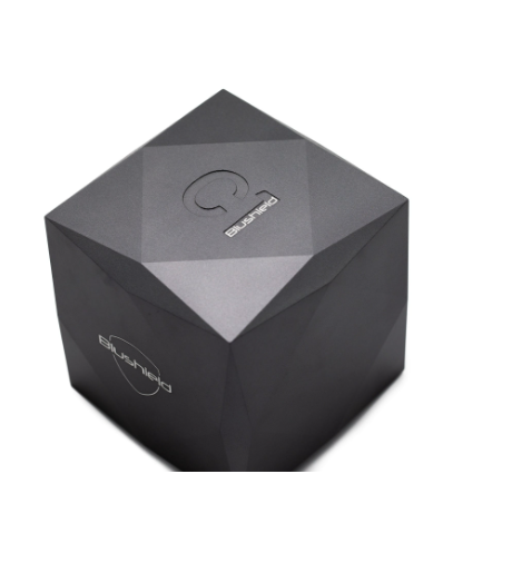 A faceted dark gray cube-shaped product box with a subtle metallic sheen, featuring the 'Blosshed' brand name and logo printed in white on two sides, set against a plain white background.