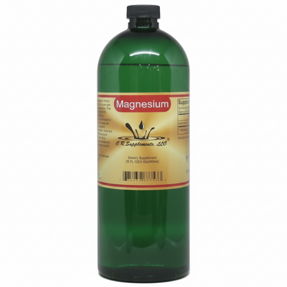 Green bottle of magnesium supplement with a label on a white background