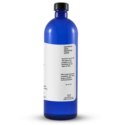 Blue bottle with a white label on a white background
