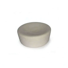 Round ivory cupcake-shaped device on a white background