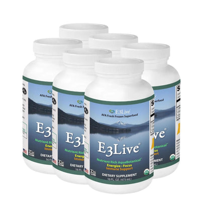 Six white supplement bottles of E3Live dietary supplements on a white background