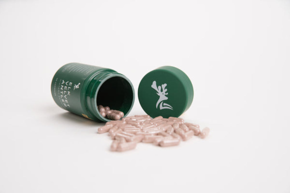 Green containers with pinkish contents on a white background