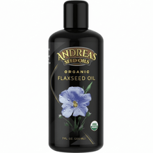 Organic Cold Pressed Flax in a black bottle with blue flower design by Andreas Seed Oils, USDA organic.