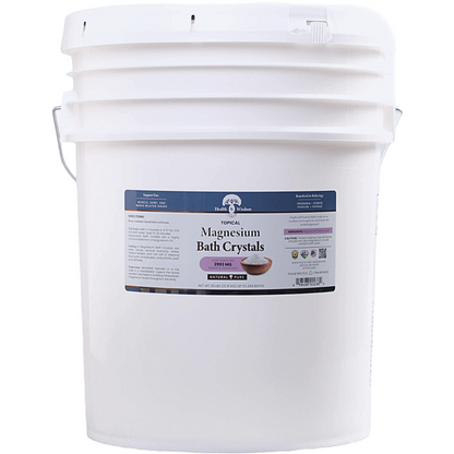 White bucket of magnesium bath crystals with a label on a white background