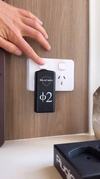Phi Φ 2 Plugin plugged into a wall outlet for EMF Protection for Small Homes.