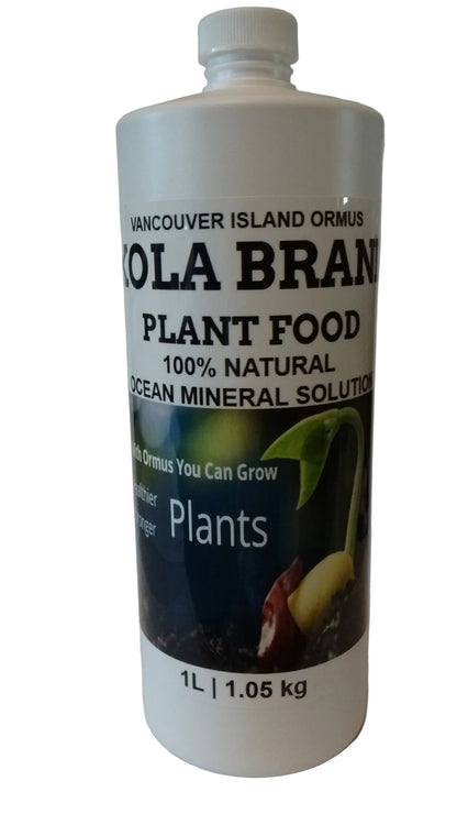 White bottle of 'Vancouver Island Ormus' cola brand plant food on a white background