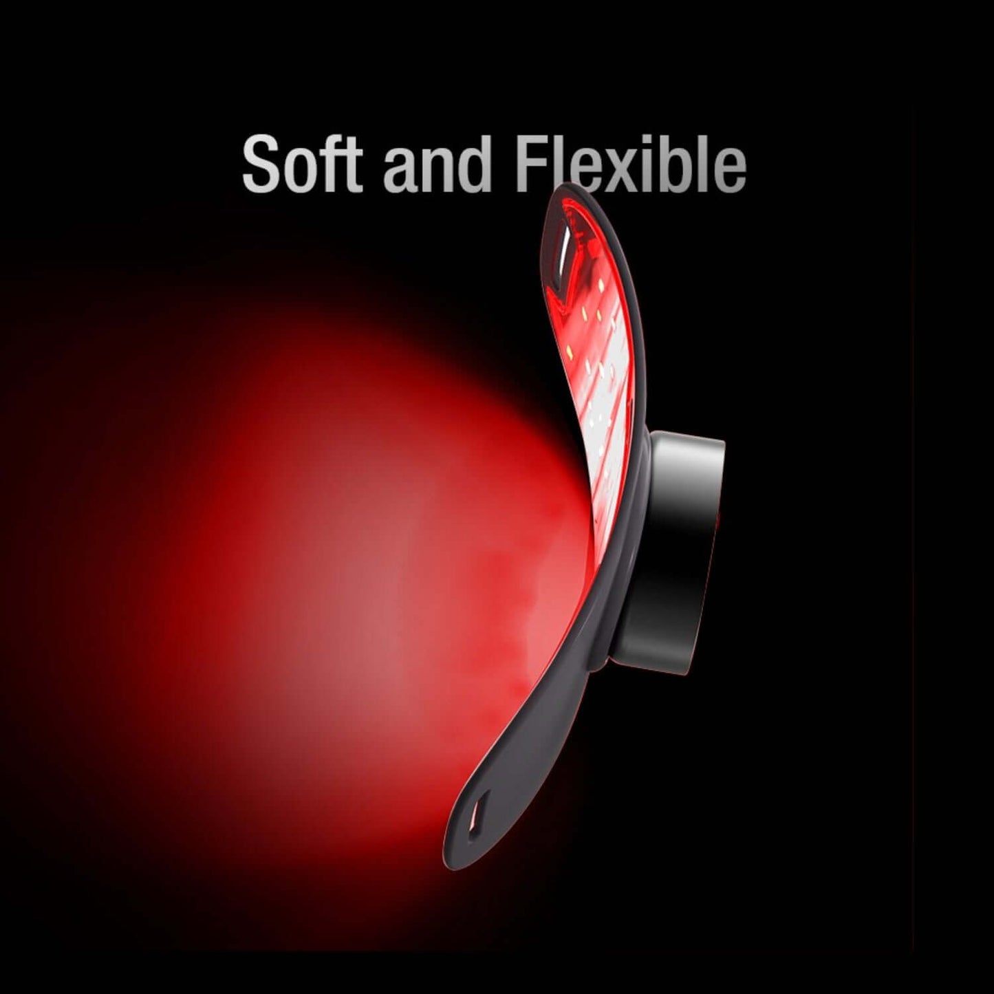 Red soft and flexible object with black base on a black background