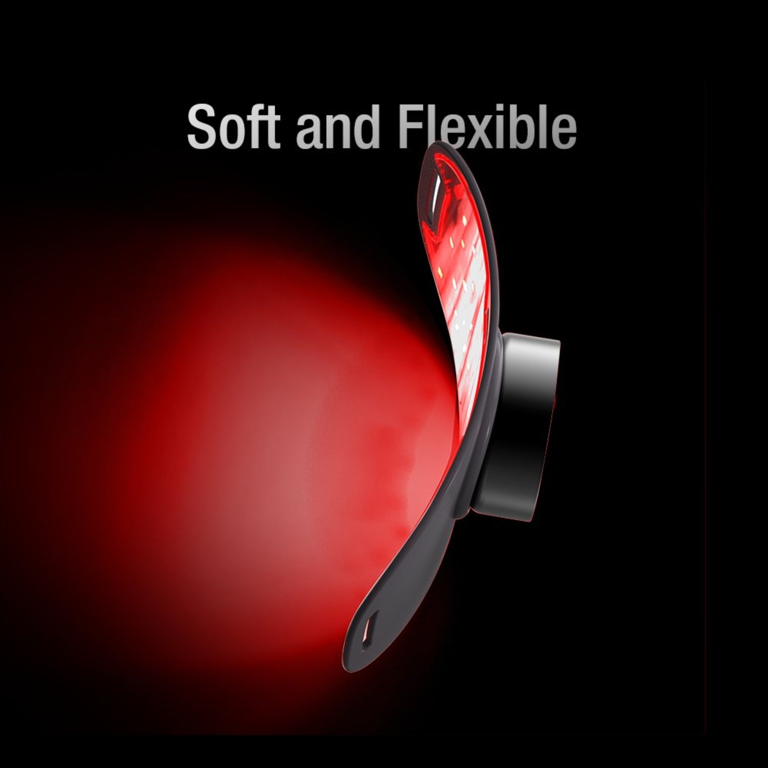 Red soft and flexible object with black base on a black background