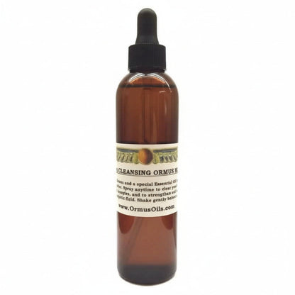brown spray bottle of Aura Cleansing ORMUS Mist, logo of wings around a circle, special essential oils, spray anytime to strengthen energetic field, www.OrmusOils.com