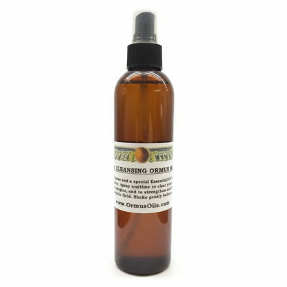 brown spray bottle of Aura Cleansing ORMUS Mist, logo of wings around a circle, special essential oils, spray anytime to strengthen energetic field, www.OrmusOils.com