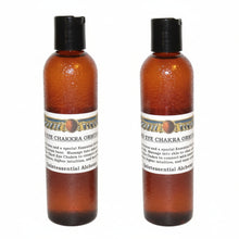 Two amber-colored bottles of Third Eye Chakra ORMUS with black caps on a white background