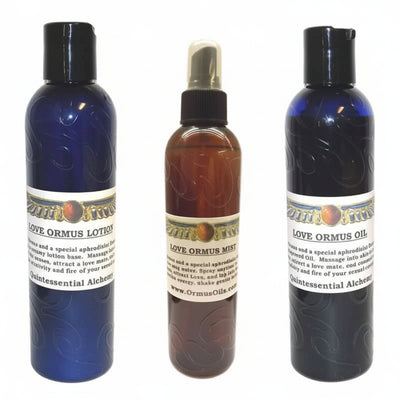 Three bottles of Love Ormus products including lotion, mist, and oil on a white background.