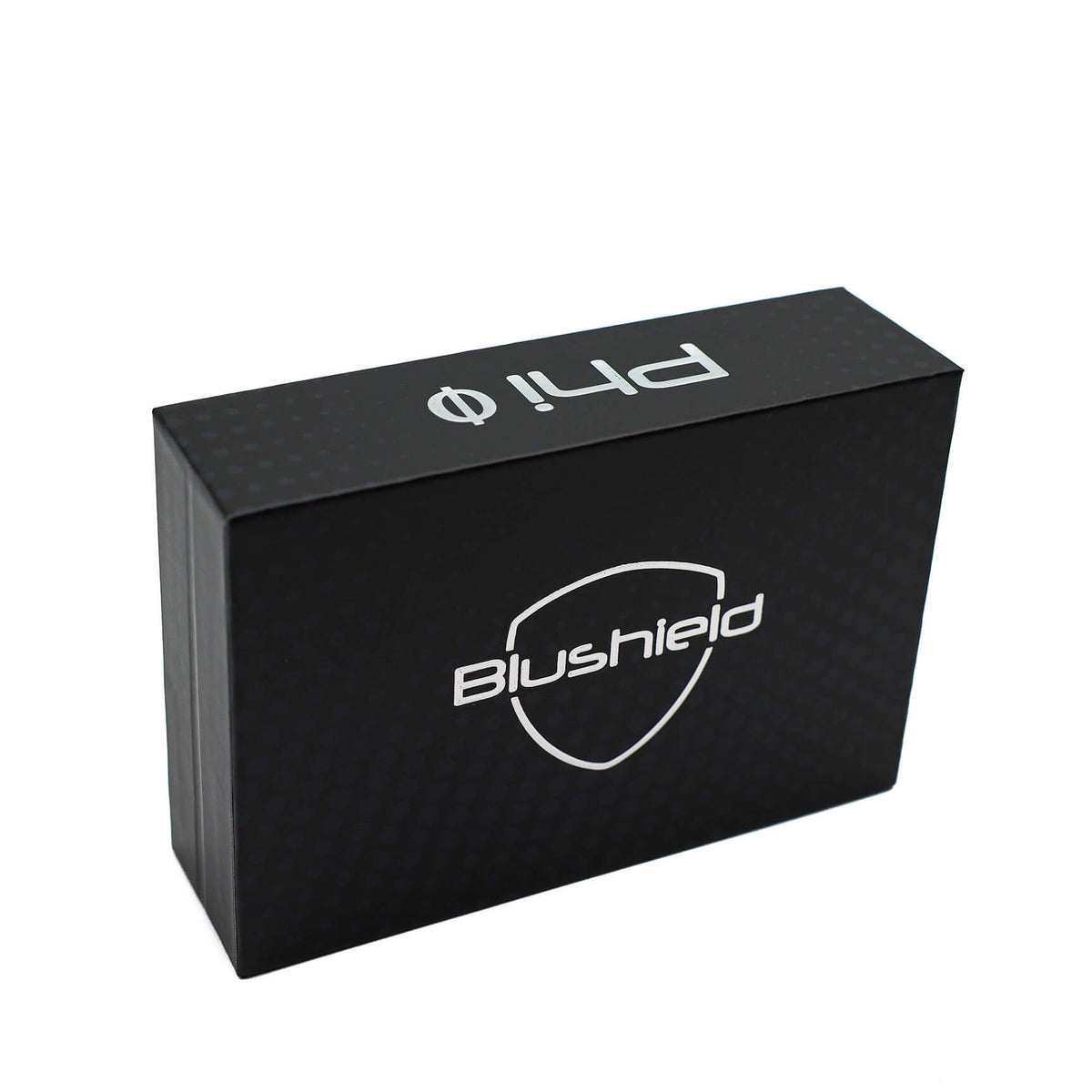 A black rectangular product box with a subtle carbon-fiber texture, featuring the 'Blushield' shield logo and 'ph1.0' branding in white on the top and front faces, set against a plain white background.