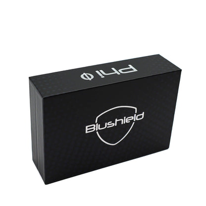 A black rectangular product box with a subtle carbon-fiber texture, featuring the 'Blushield' shield logo and 'ph1.0' branding in white on the top and front faces, set against a plain white background.