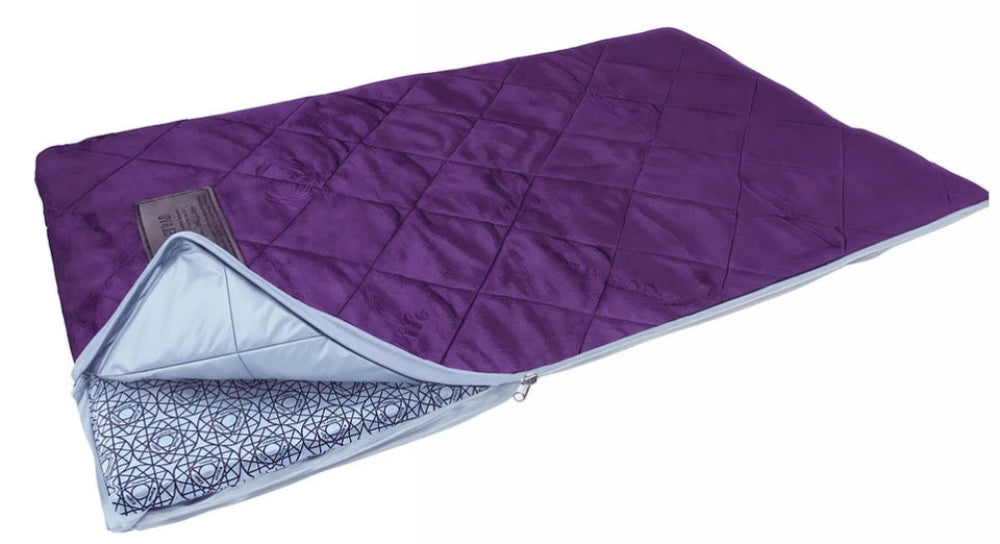 A purple quilted sleeping pad with a light blue underside and a dark blue geometric patterned lining, shown on a white background.