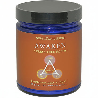 blue jar with black lid, brown label, SuperTonicHerbs, AWAKEN Stress-Free Focus, triangle with ORMUS inside and these words at corners: SHEN, CHI, JING. REHMANNIA DEAN THOMAS, 90 grams, 10:1 powdered extract