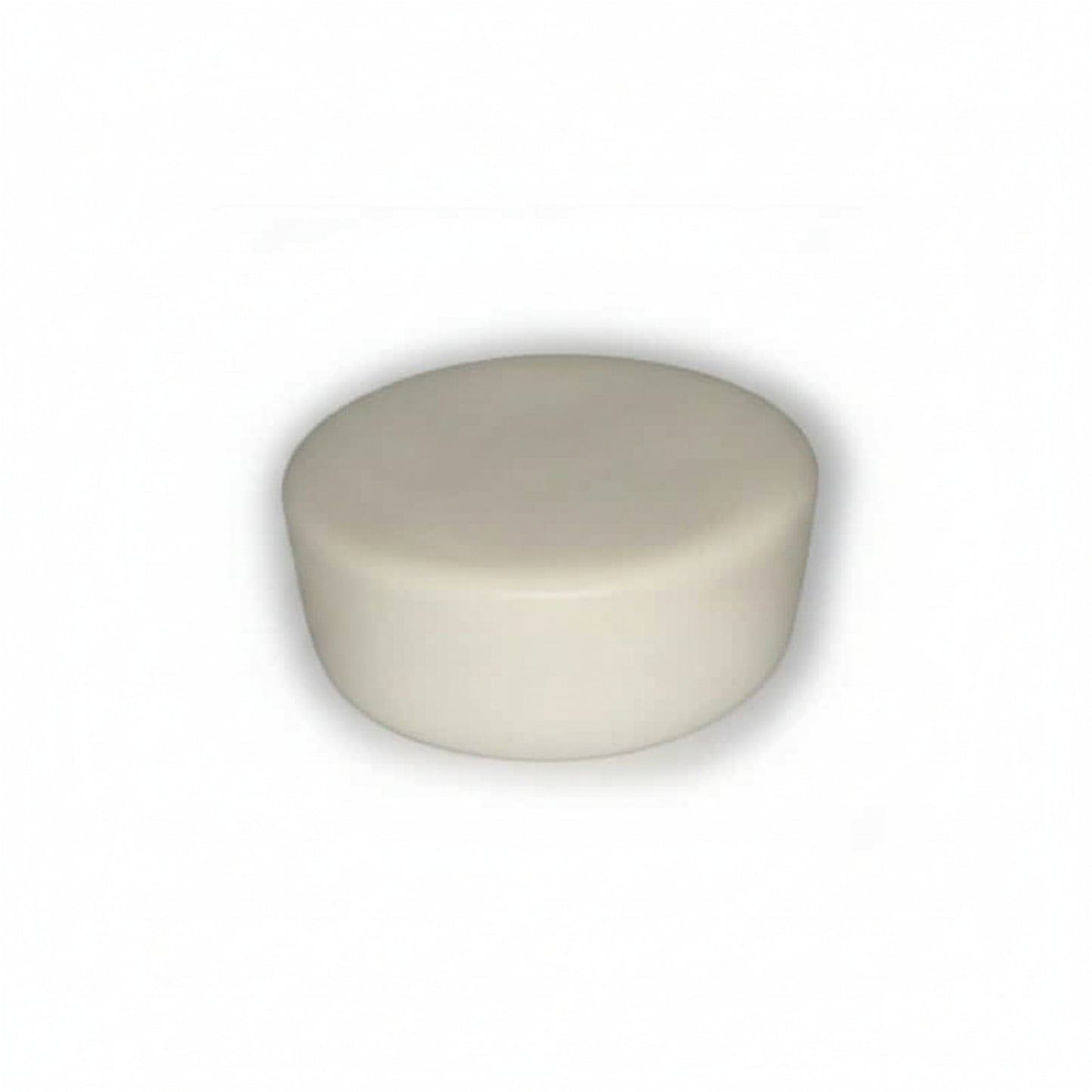 Round ivory cupcake-shaped device on a white background