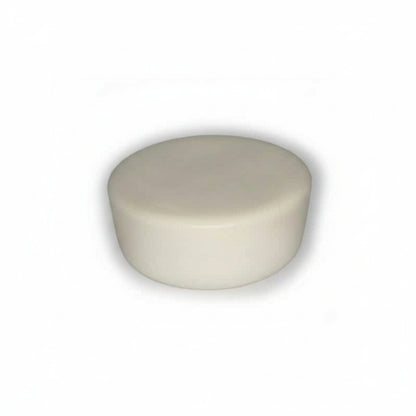 Round ivory cupcake-shaped device on a white background