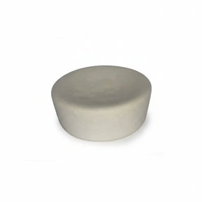 Round ivory cupcake-shaped device on a white background