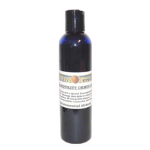 Black bottle of Ormus oil with a label on a white background
