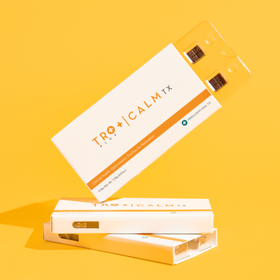 Tro+ Calm Buccal Troches for Relaxation packaging on bright orange background.