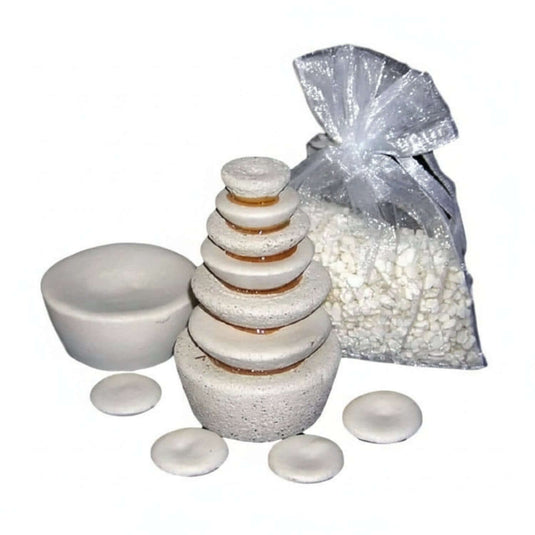 Bundle of Energy Harmonizing Tools including stacked stones and a bag of energizing crystals.