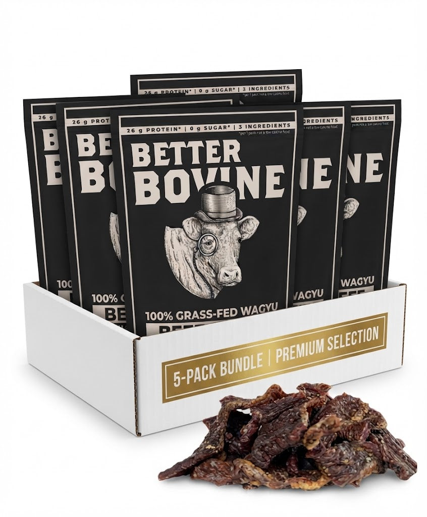 A 5-pack display box of Better Bovine jerky with several black packages arranged in a white tray, plus a small pile of dark brown jerky strips in front on a white background.