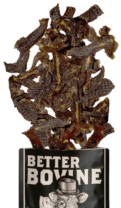 Dried beef jerky in a container labeled 'Better Bovine' on a white background