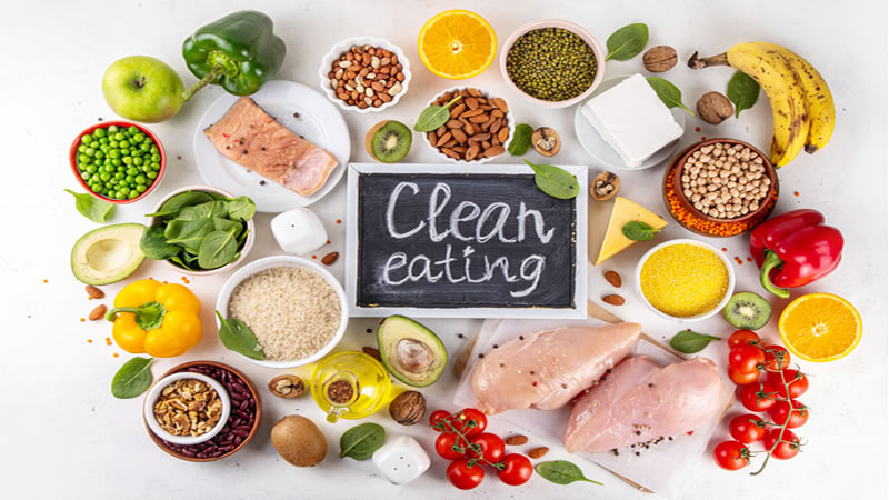 healthy food surrounding sign "Clean Eating"